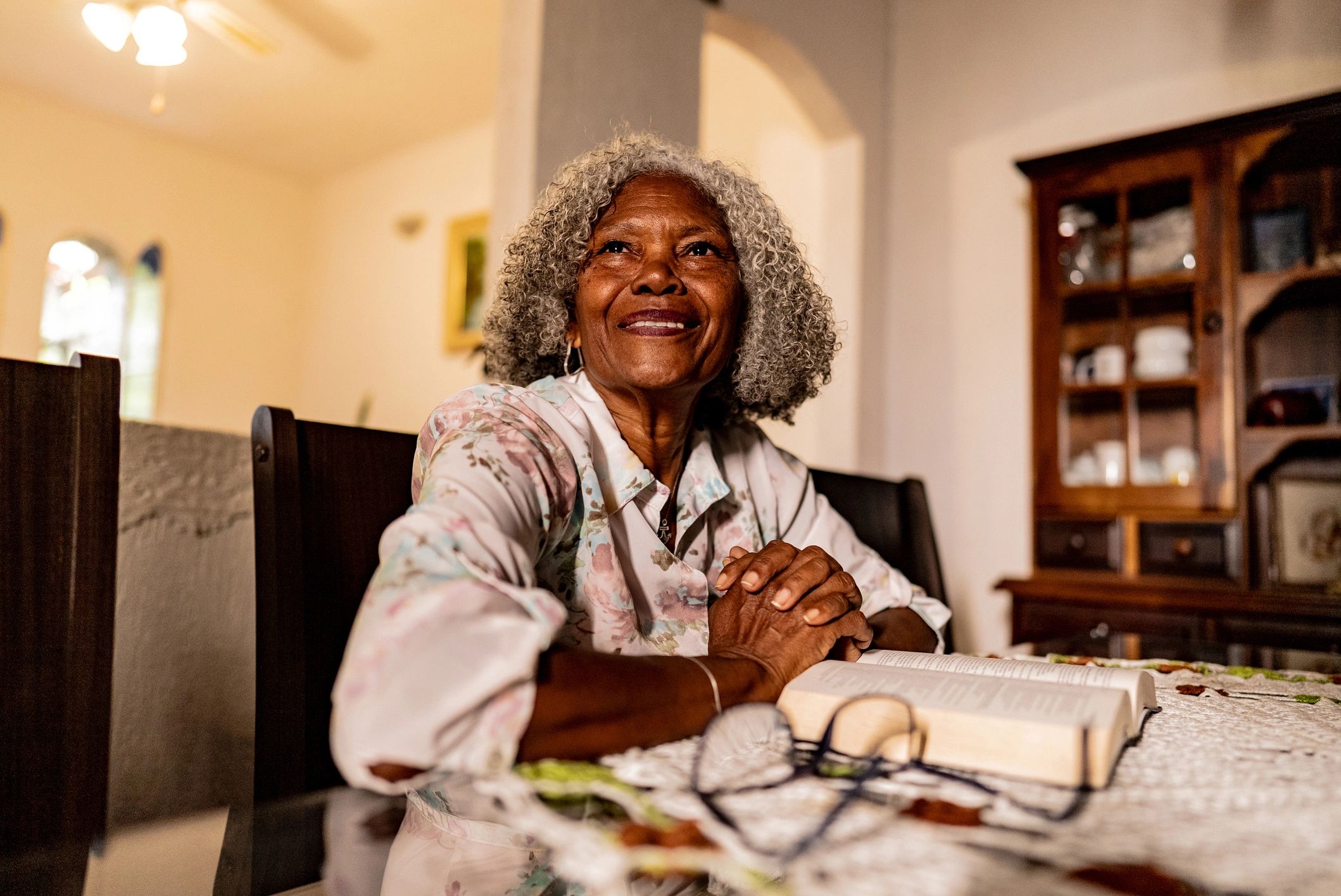 Woman reading the Bible at home